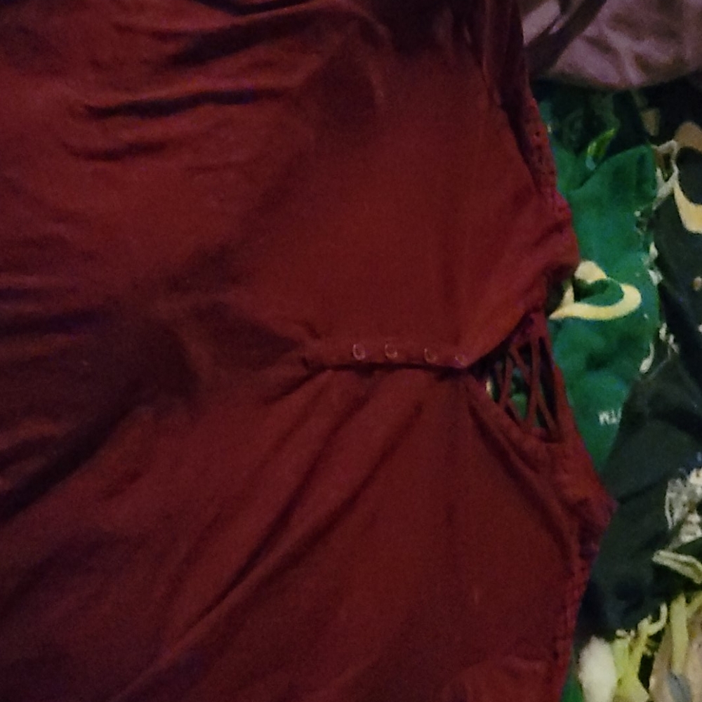 Mid sleeve red blouse with lace on shoulders.